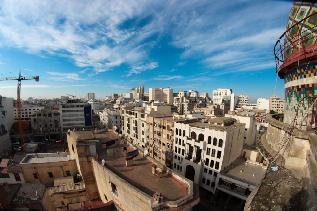 High-angle view of Casablanca's urban skyline under a vibrant blue sky.